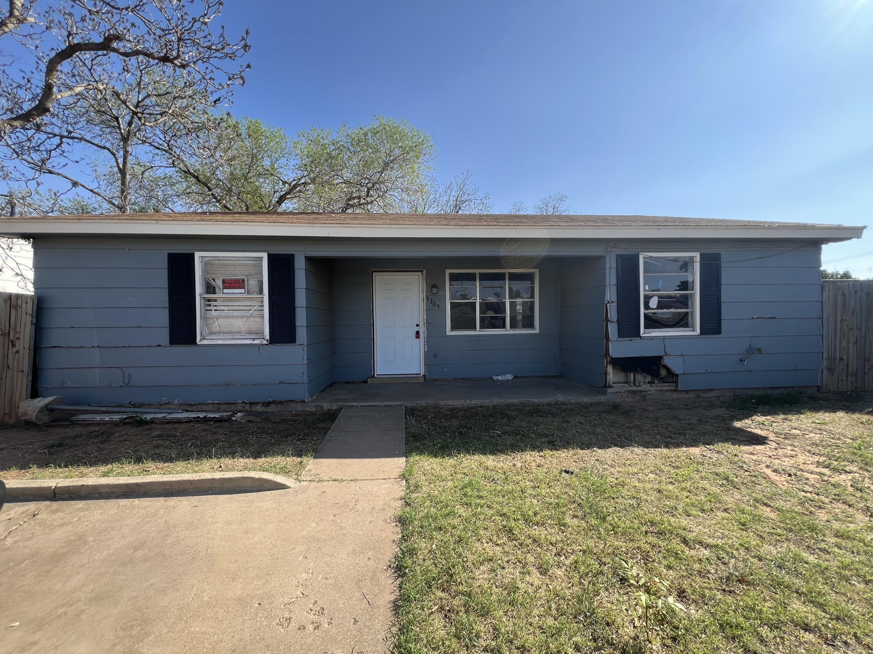 1309 32nd Street Lubbock, TX 79411 - Photo 1 of 28 a view of a house with a yard