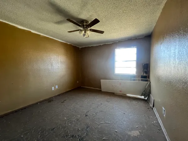 a room with wooden floor and furniture