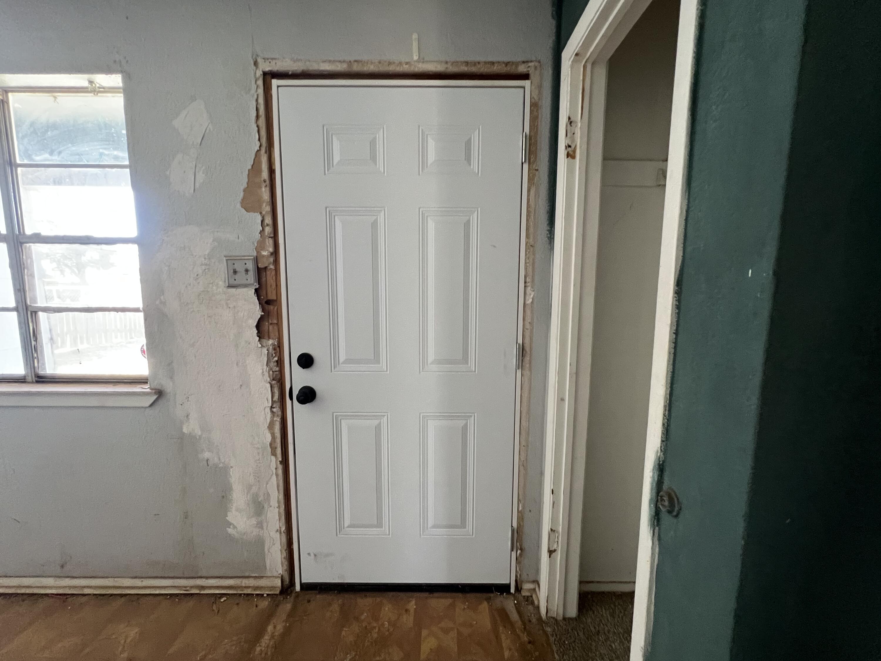 1309 32nd Street Lubbock, TX 79411 - Photo 2 of 28 a view of a small space with wooden floor and a window