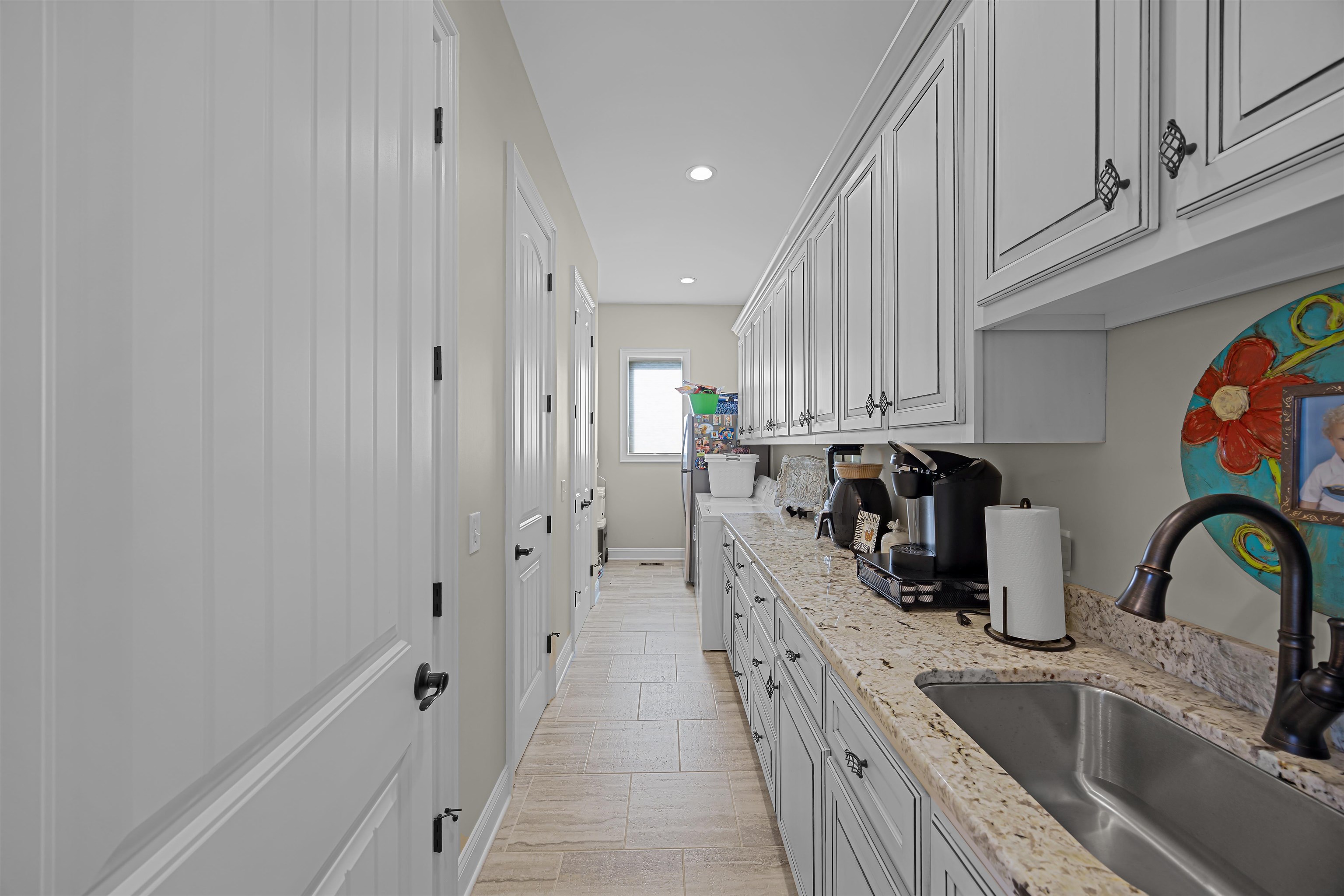 45 Pinnacle Pointe Savannah, TN 38372 - Photo 16 of 30 Laundry room with recessed lighting and light stone counters