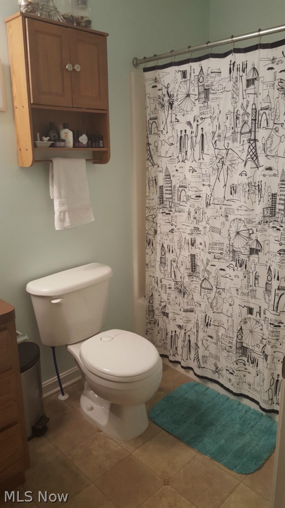 2332 Ravenna Road Kent, OH 44240 - Photo 14 of 25 2332 Ravenna Rd, Kent, OH 44240 The main bath has a full tub/shower unit and oak vanity and accessory cabinet.
