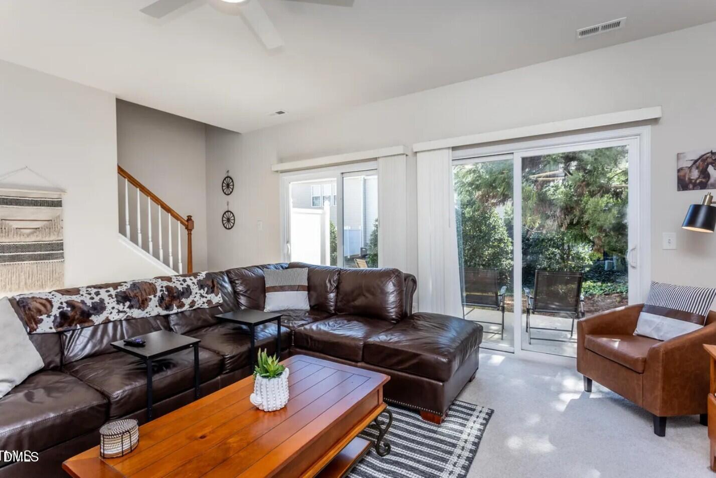 7031 Racine Way Raleigh, NC 27615 - Photo 12 of 24 a living room with furniture and a large window