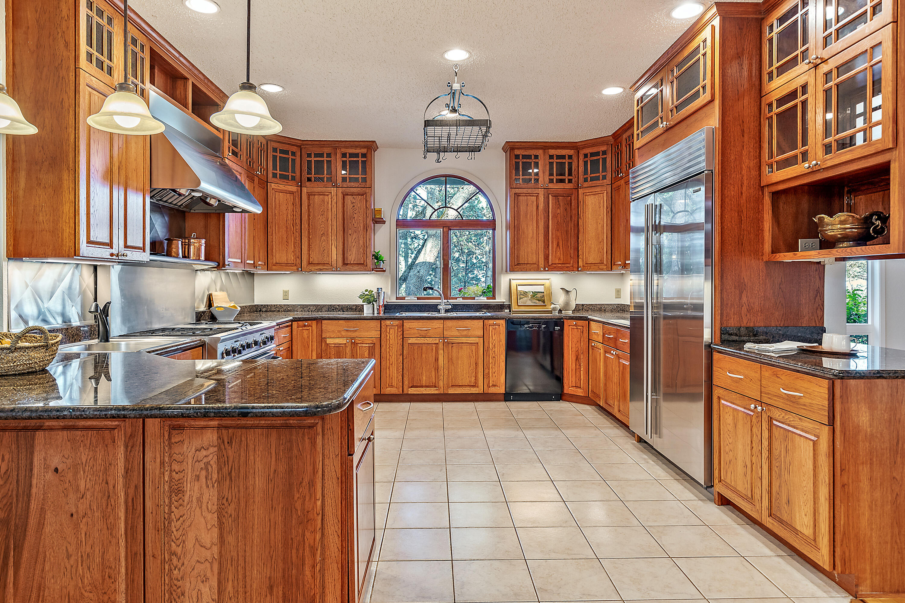 3333 Old Stage Road Central Point, OR 97502 - Photo 42 of 68 a kitchen with stainless steel appliances granite countertop a sink and a stove