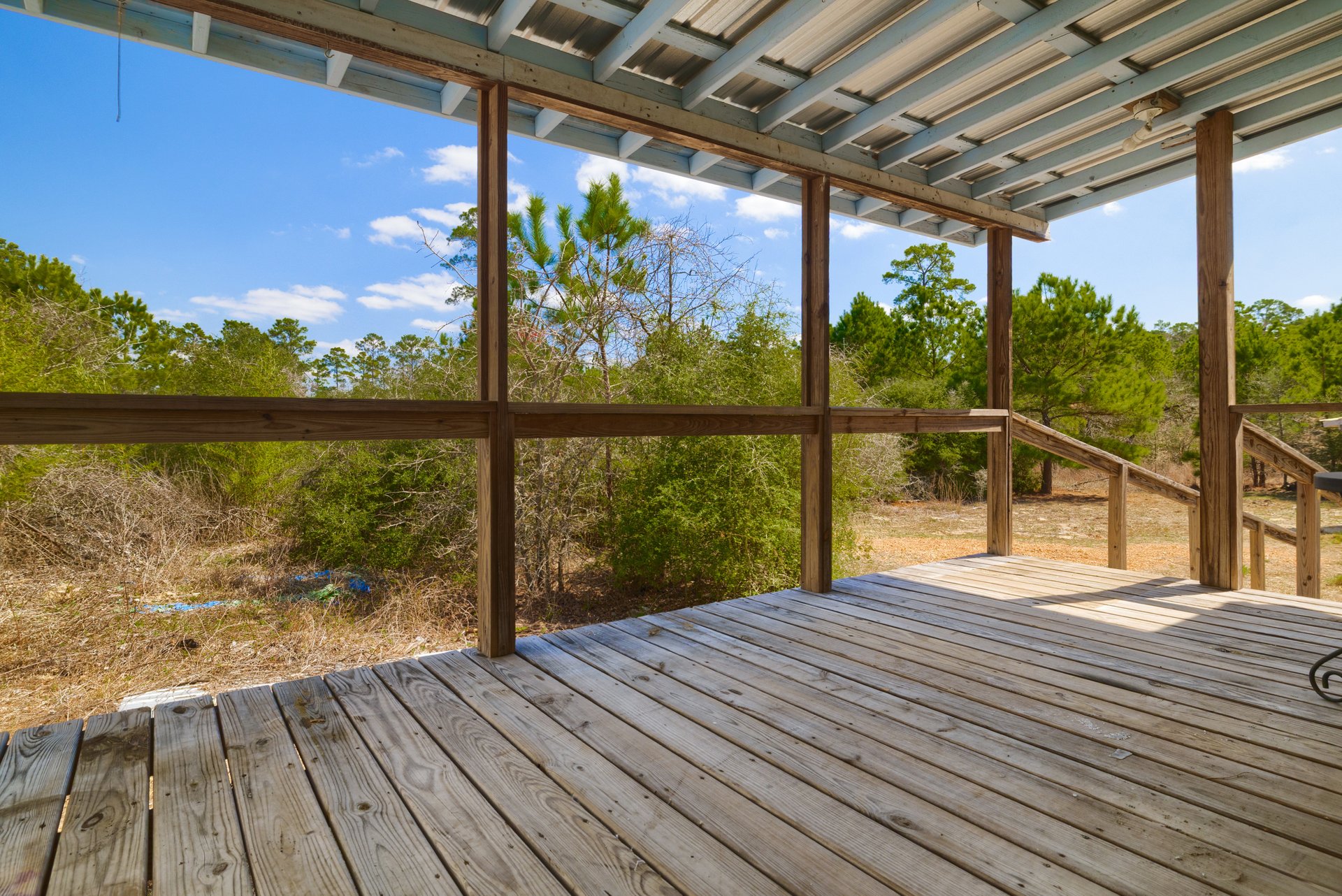 270 Kelley Road West Bastrop, TX 78602 - Photo 18 of 29 a view of a balcony with wooden floor