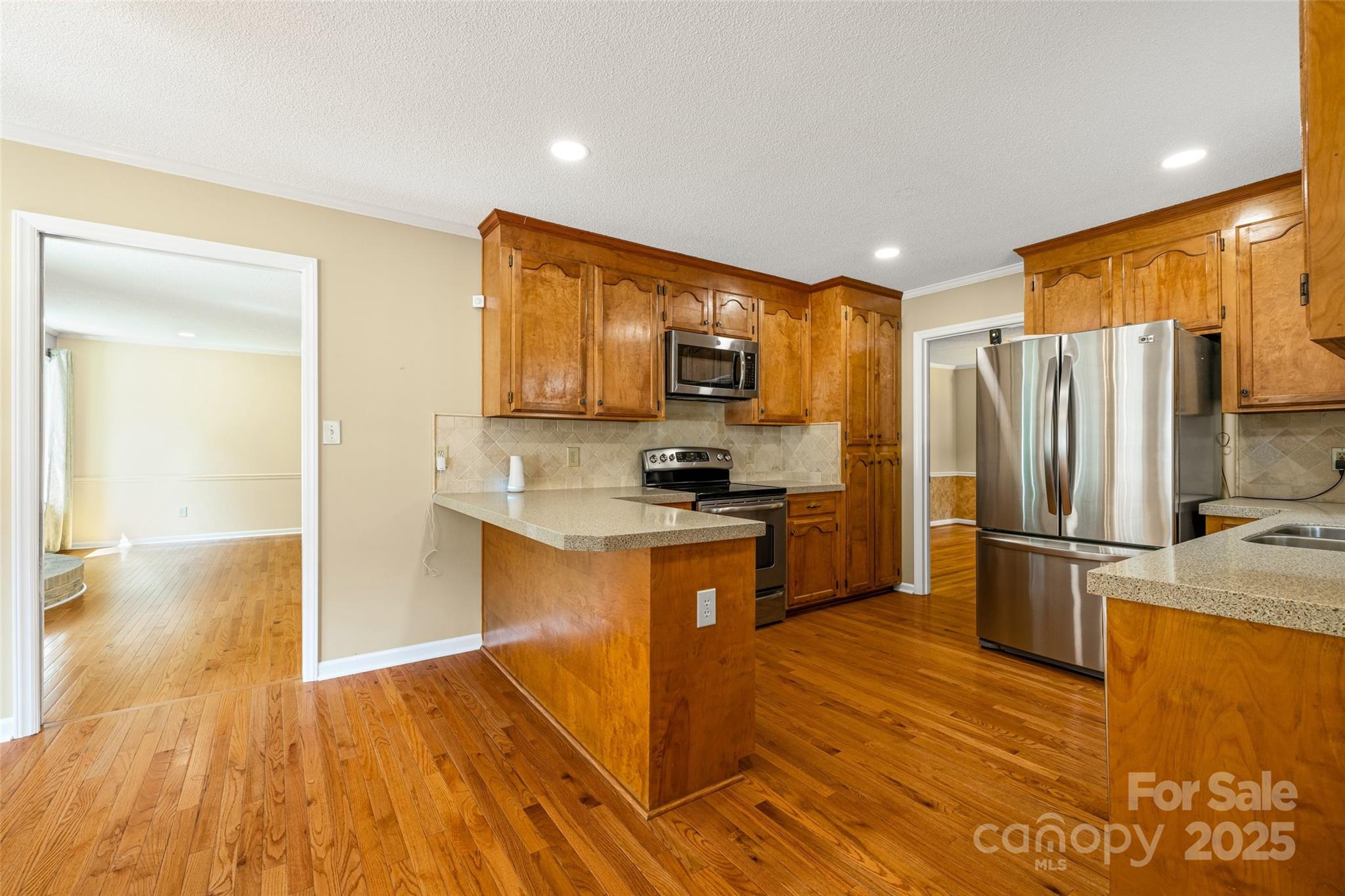 229 Campsite Road Rock Hill, SC 29732 - Photo 14 of 45 a kitchen with stainless steel appliances granite countertop a refrigerator microwave and stove
