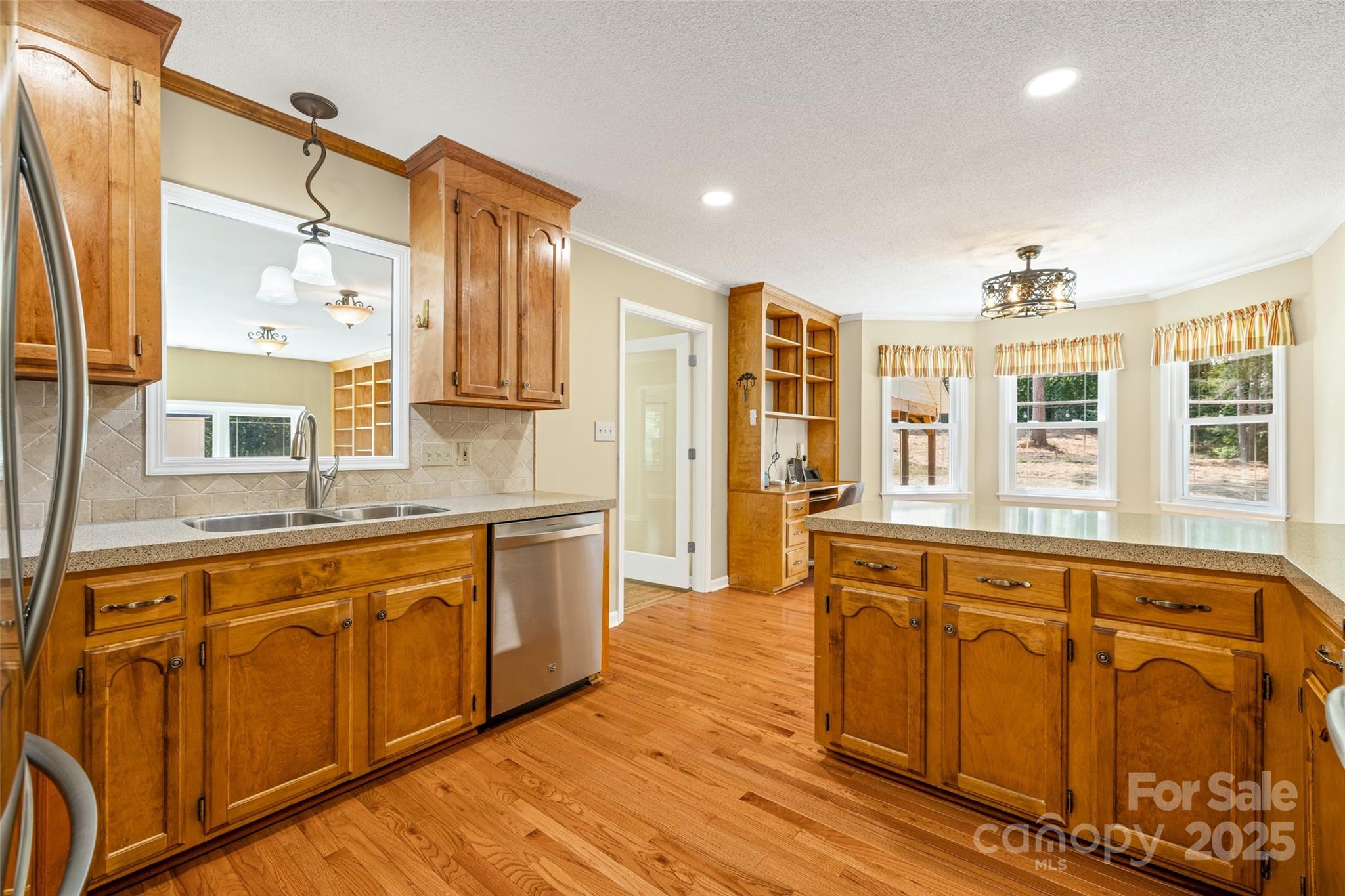 229 Campsite Road Rock Hill, SC 29732 - Photo 15 of 45 a spacious bathroom with stainless steel appliances granite countertop a sink and wooden cabinets