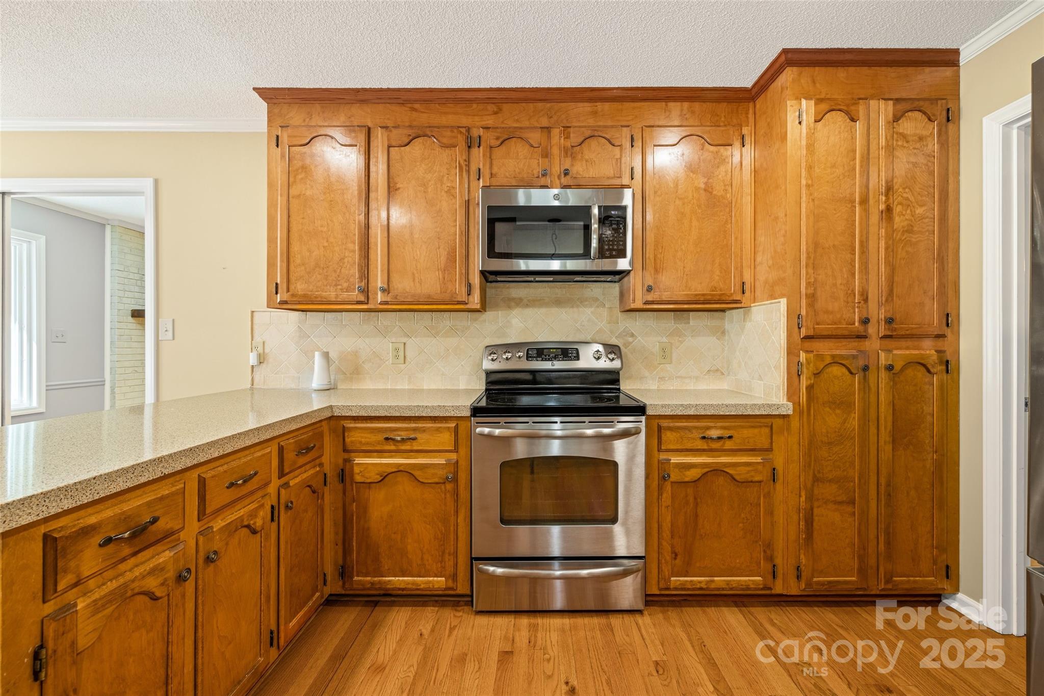 229 Campsite Road Rock Hill, SC 29732 - Photo 16 of 45 a kitchen with stainless steel appliances granite countertop a stove a sink and a microwave