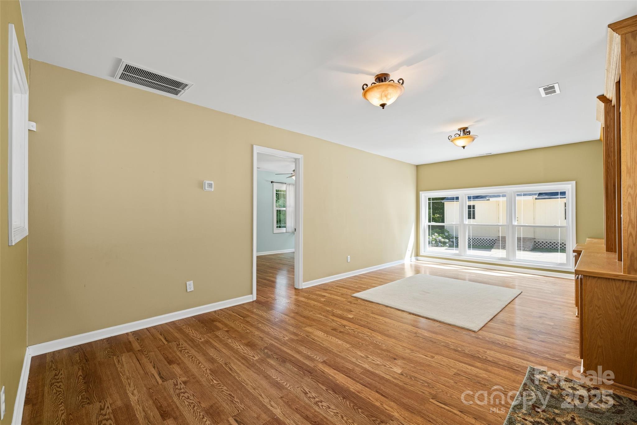 229 Campsite Road Rock Hill, SC 29732 - Photo 19 of 45 a view of empty room with wooden floor and fan