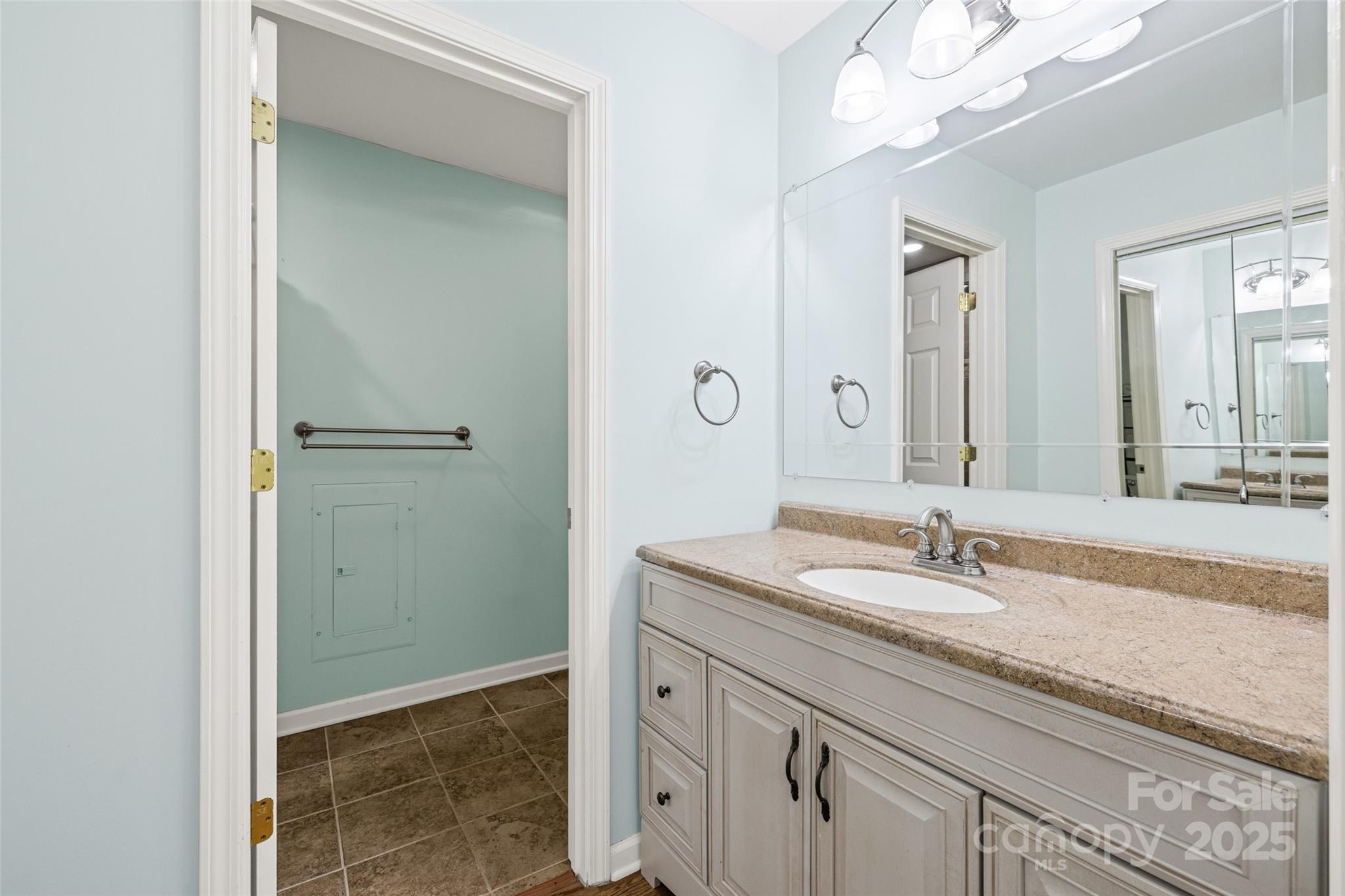 229 Campsite Road Rock Hill, SC 29732 - Photo 23 of 45 a bathroom with a granite countertop sink a mirror and a shower