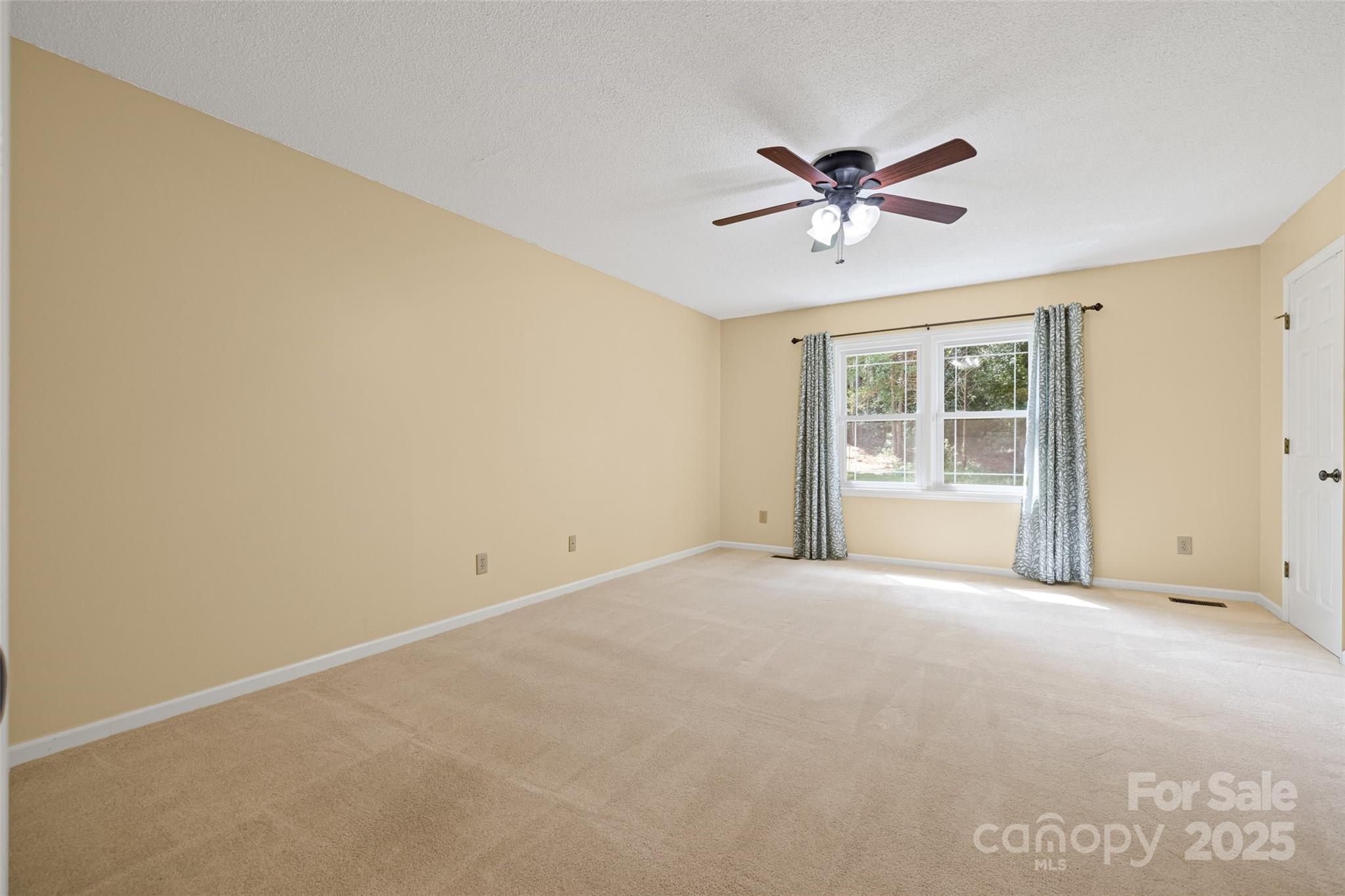 229 Campsite Road Rock Hill, SC 29732 - Photo 26 of 45 a view of a livingroom with a window and a ceiling fan