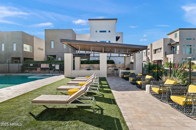 a outdoor space with lots of tables a garden and chairs