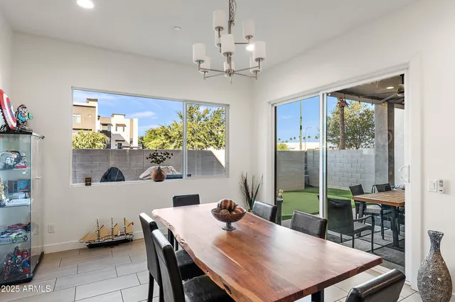 a view of a dining room with furniture window and outside view