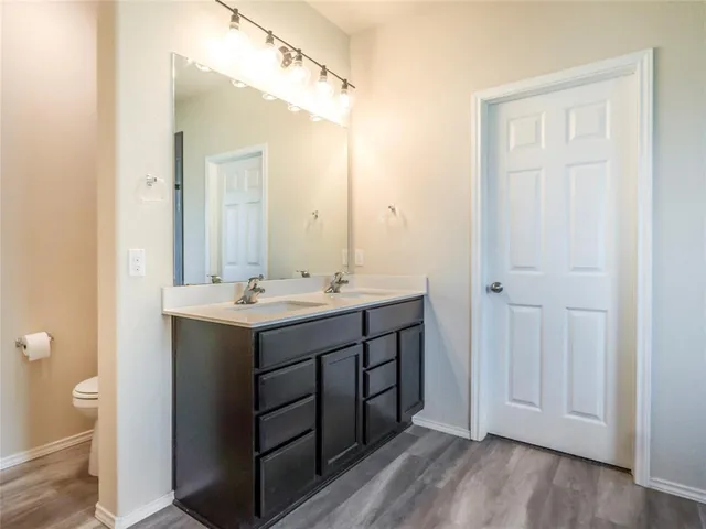 a bathroom with a shower and a sink