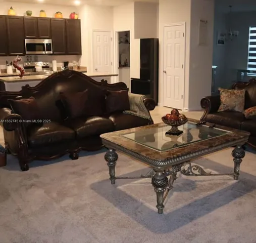 a living room with furniture and a couch