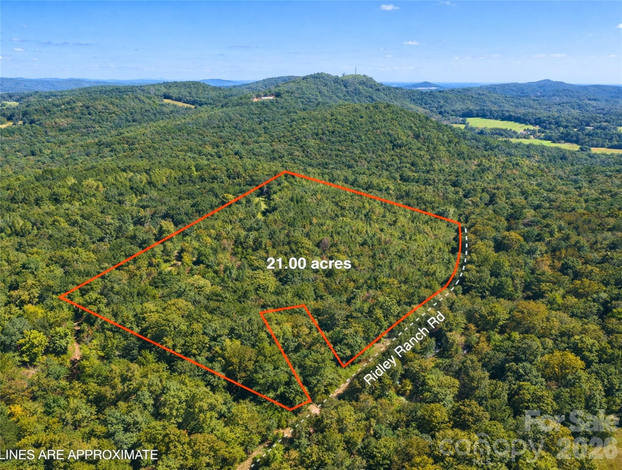 00 Ridley Ranch Road, Unit LOT 2 Hiddenite, NC 28636 - Photo 12 of 23 a view of a lush green field with an ocean view
