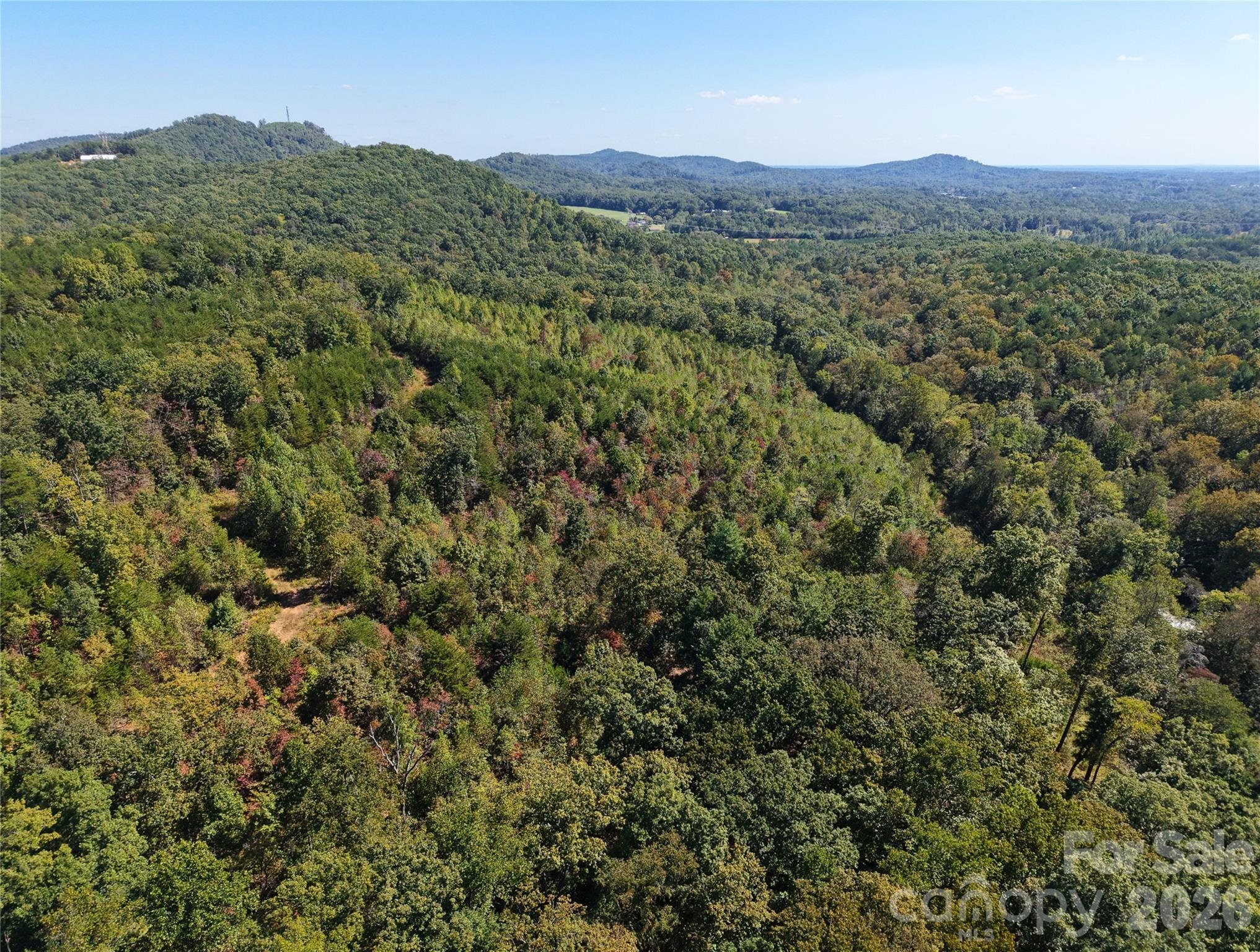 00 Ridley Ranch Road, Unit LOT 2 Hiddenite, NC 28636 - Photo 18 of 23 a view of a mountain in the distance in a field