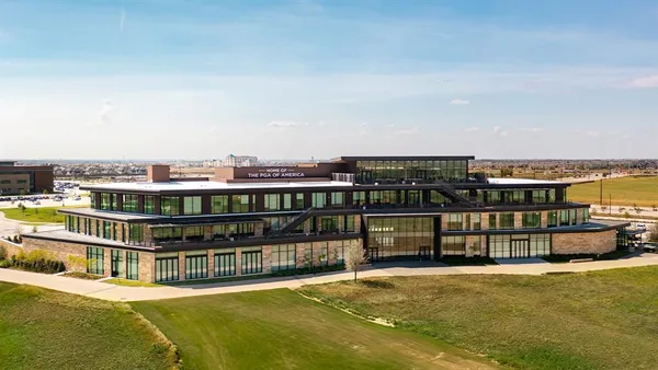 a view of a swimming pool and outdoor seating