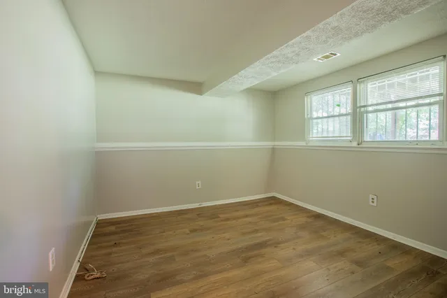 an empty room with a empty space and window