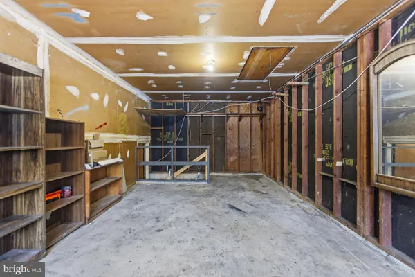 a view of an empty room with empty shelves