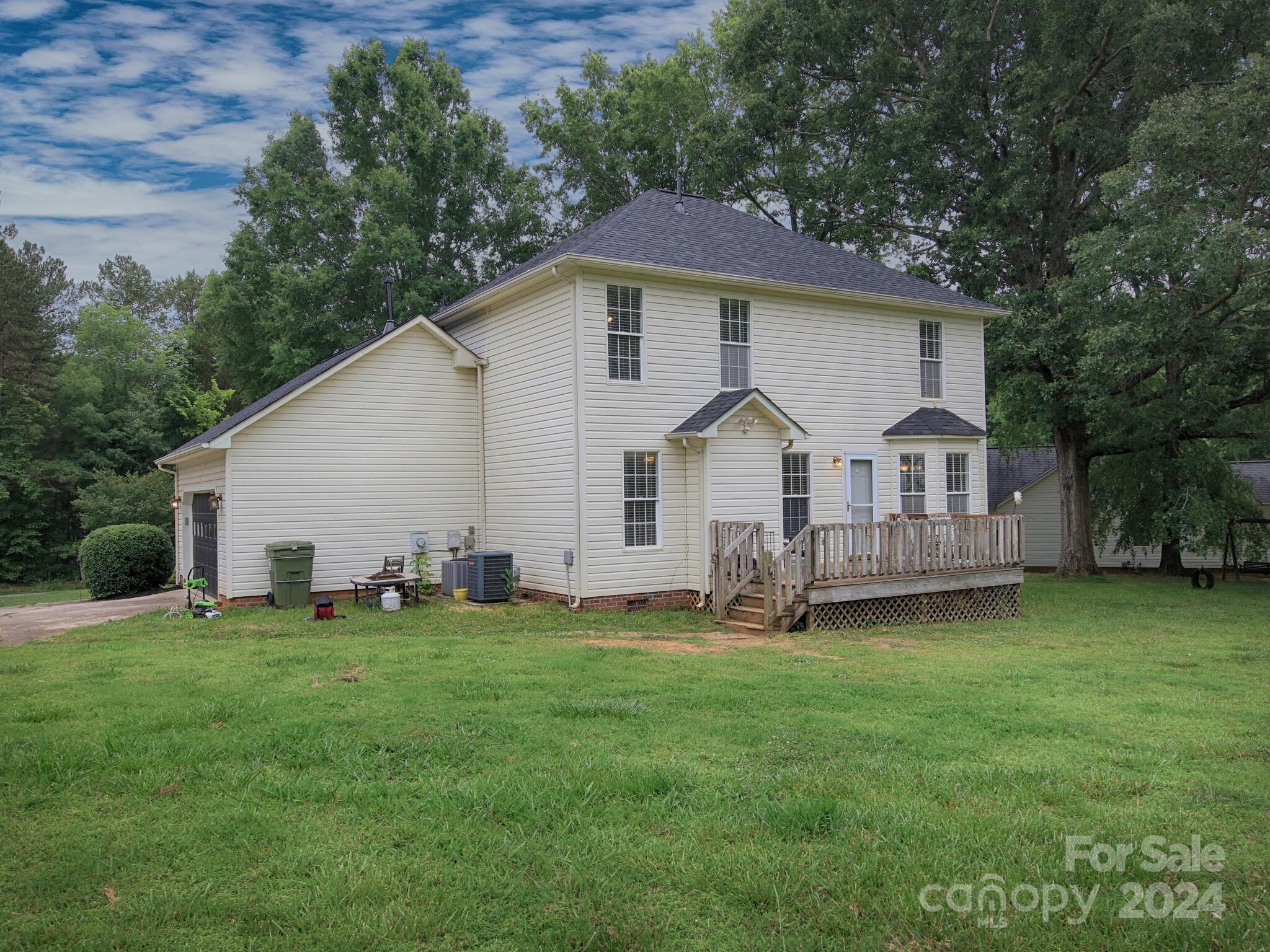 444 Cress Loop Road Salisbury, NC 28147 - Photo 25 of 27 a front view of a house with a yard and trees