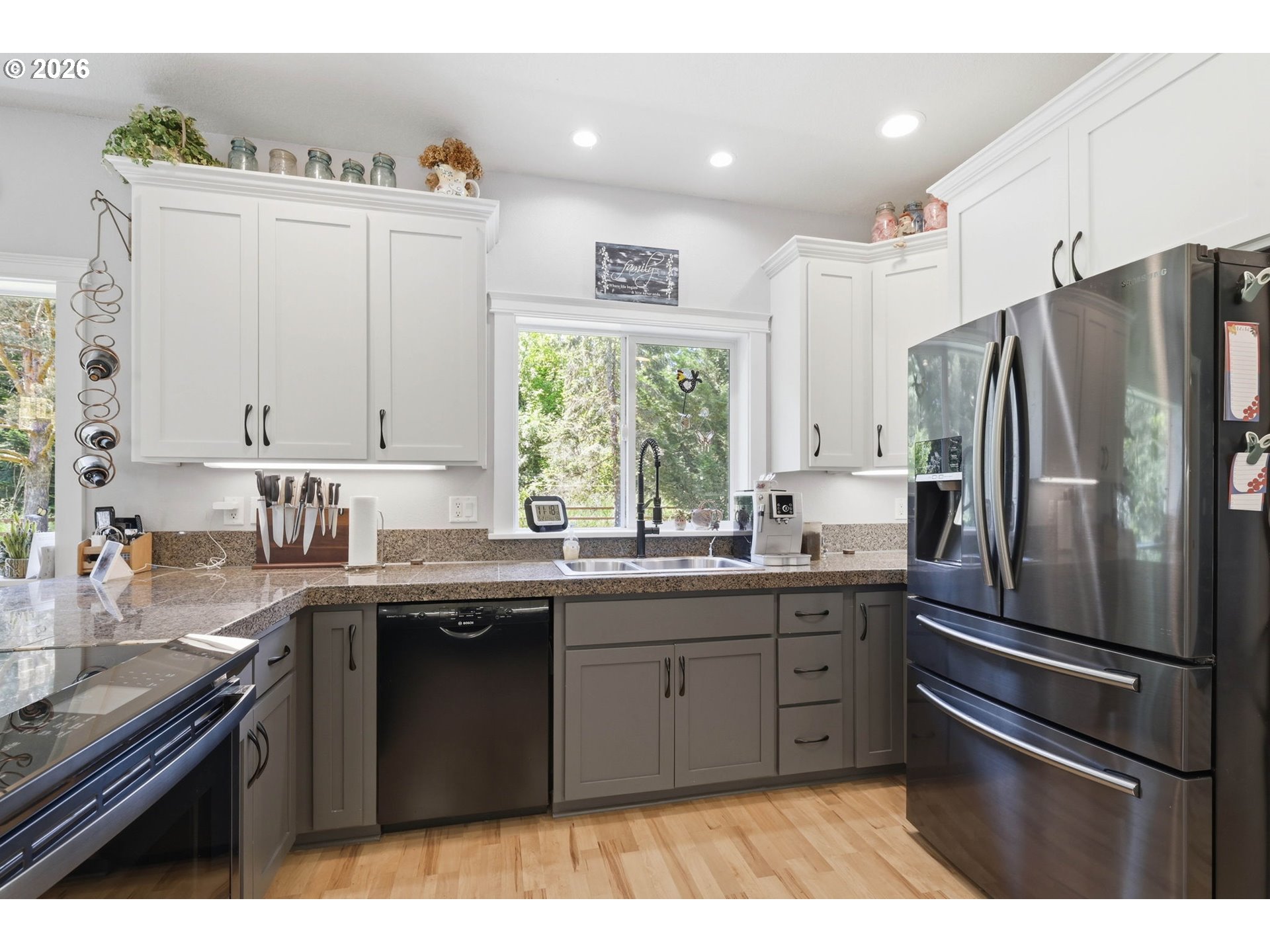 29778 Gimpl Hill Road Eugene, OR 97405 - Photo 11 of 43 a kitchen with stainless steel appliances granite countertop a sink a stove a refrigerator and cabinets