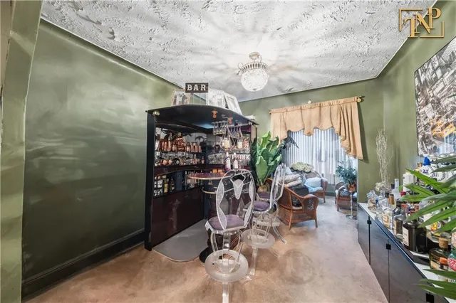a dining room with furniture and flowers