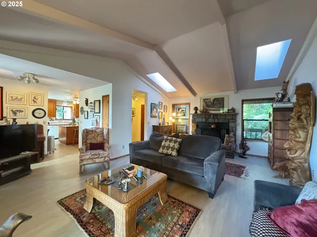 a living room with furniture and a dresser