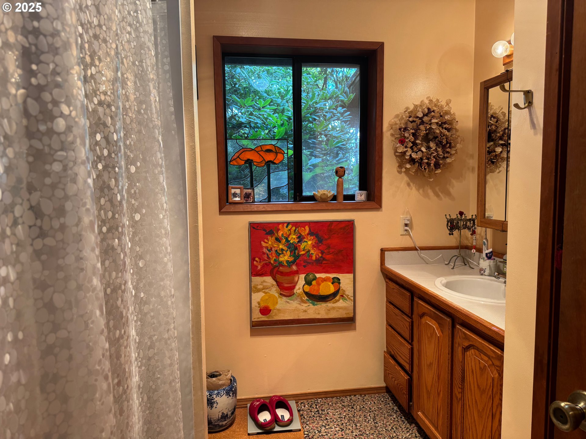 88468 Trout Pond Lane Southwest Bandon, OR 97411 - Photo 16 of 44 a bathroom with a sink and a painting on the wall