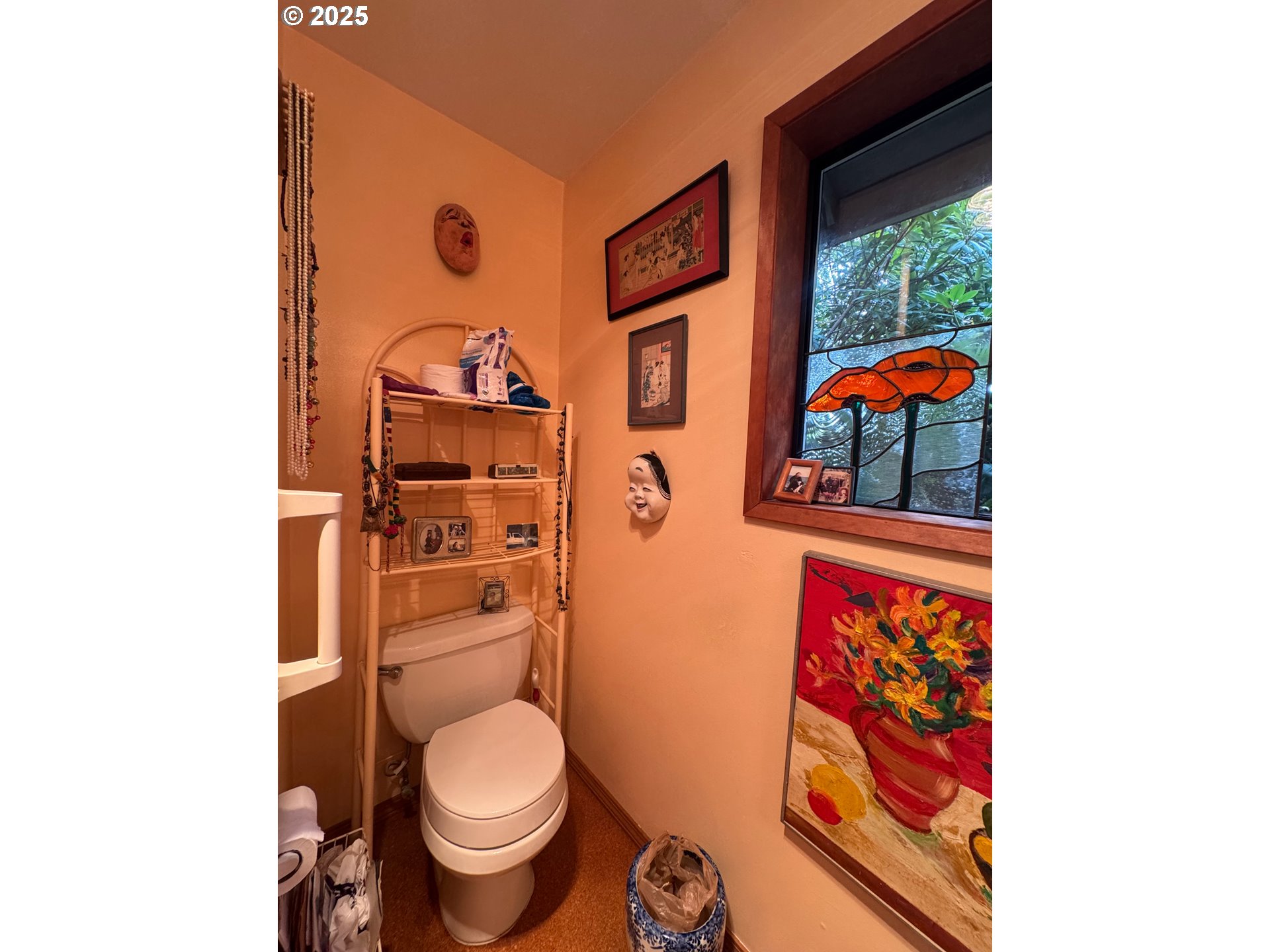 88468 Trout Pond Lane Southwest Bandon, OR 97411 - Photo 17 of 44 a bathroom with a toilet and a shower curtain