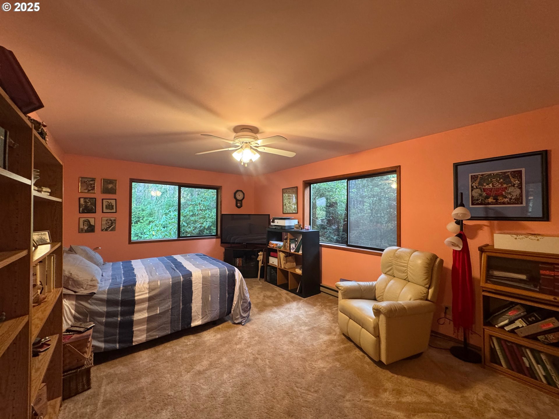 88468 Trout Pond Lane Southwest Bandon, OR 97411 - Photo 18 of 44 a bedroom with furniture and a large window