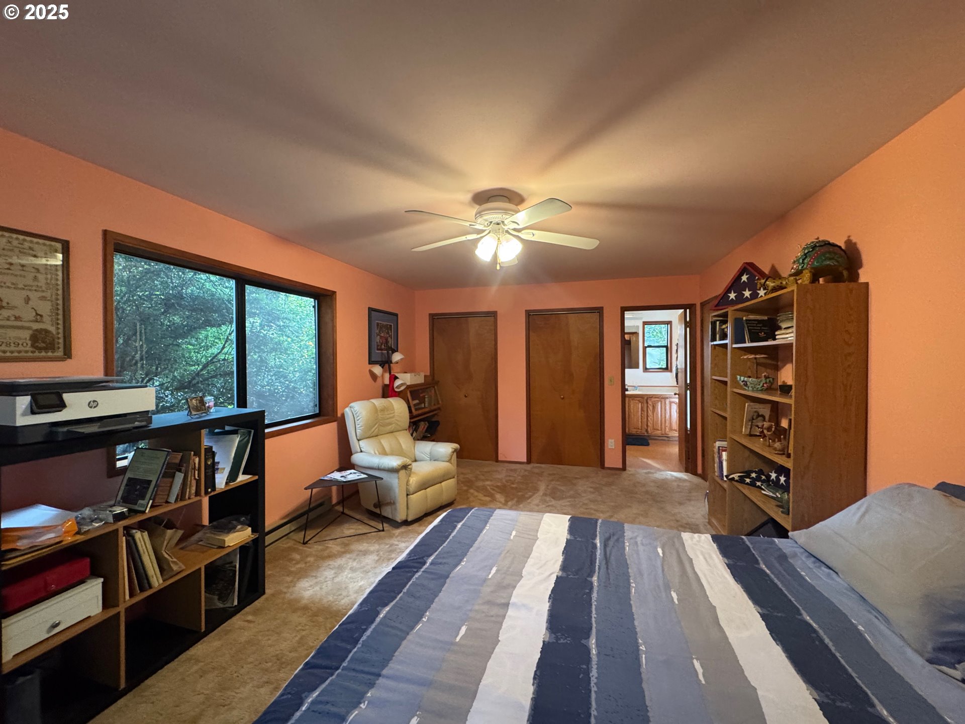 88468 Trout Pond Lane Southwest Bandon, OR 97411 - Photo 19 of 44 a living room with furniture a lamp wooden floor and a large window
