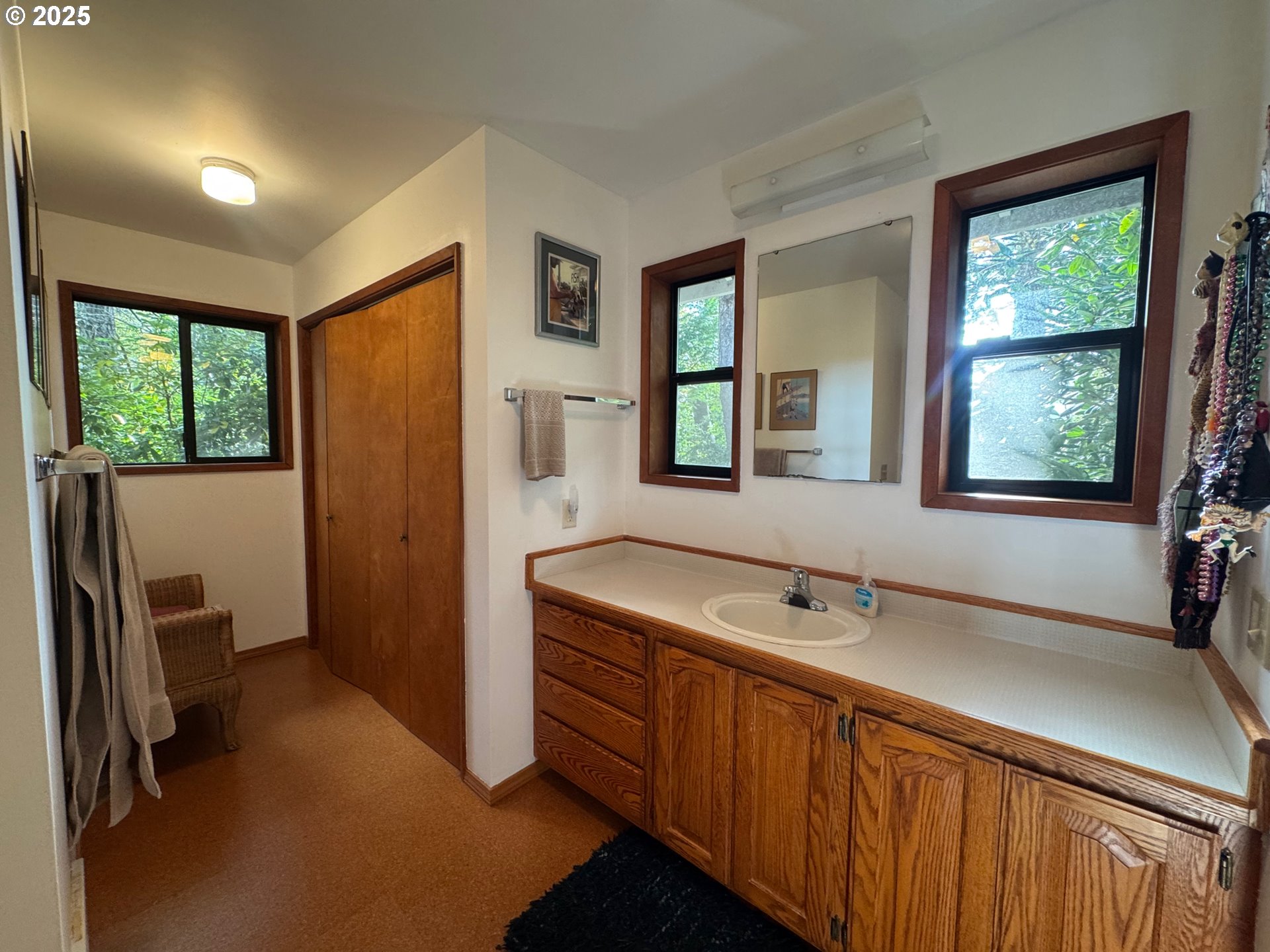 88468 Trout Pond Lane Southwest Bandon, OR 97411 - Photo 20 of 44 a bathroom with a sink and a mirror