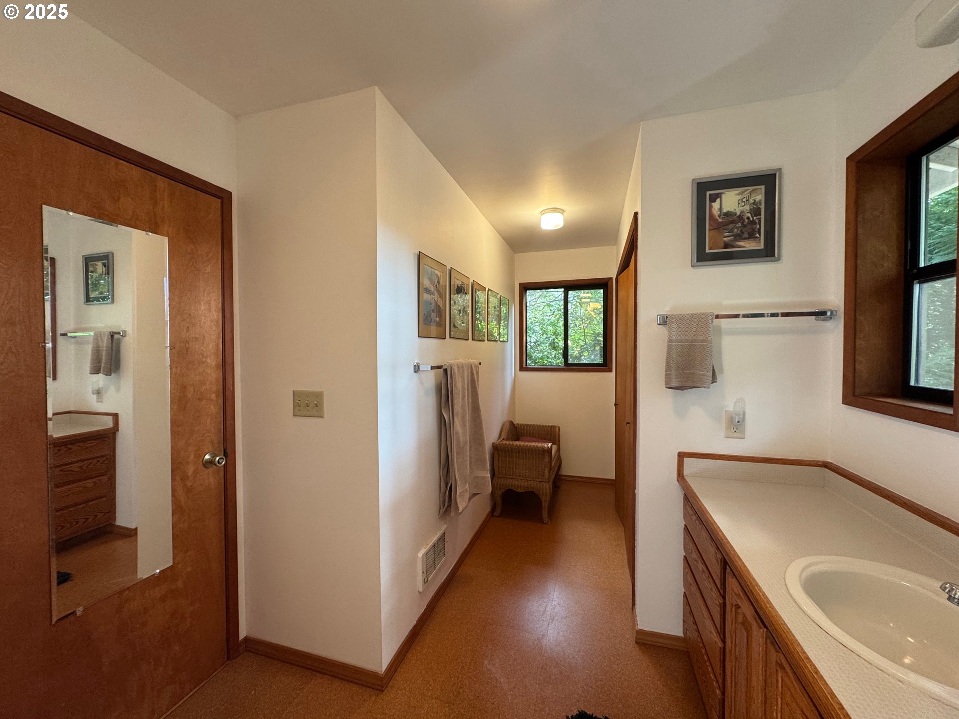 88468 Trout Pond Lane Southwest Bandon, OR 97411 - Photo 22 of 44 a en suite bathroom with a sink a mirror and a shower