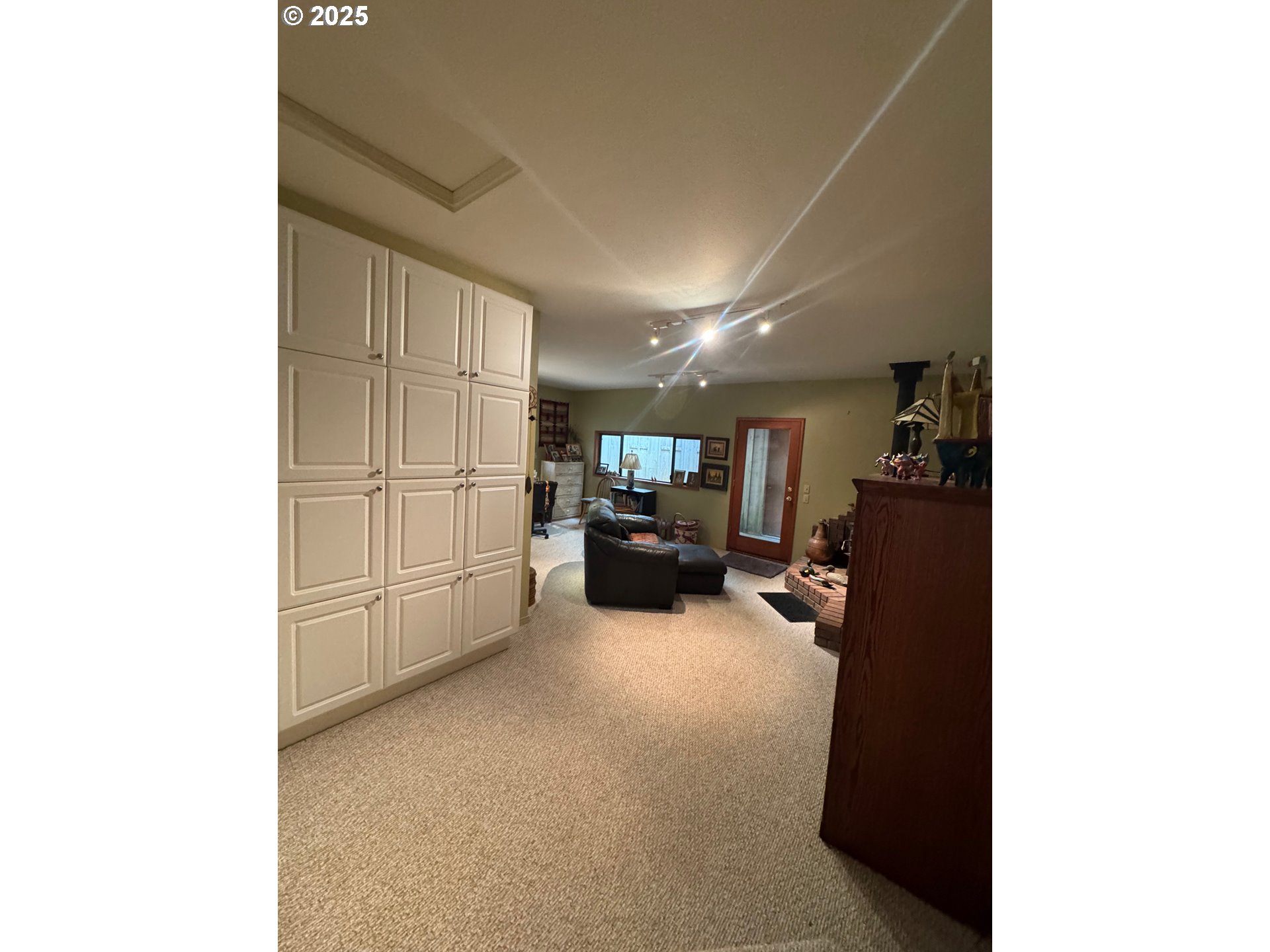 88468 Trout Pond Lane Southwest Bandon, OR 97411 - Photo 23 of 44 a living room with furniture and a flat screen tv
