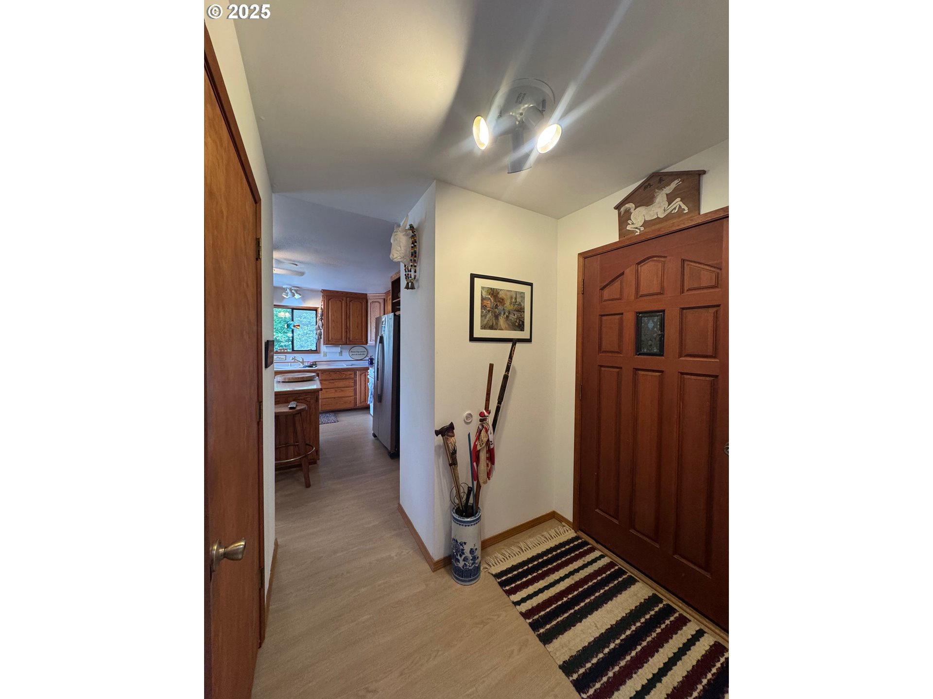 88468 Trout Pond Lane Southwest Bandon, OR 97411 - Photo 3 of 44 a view of a hallway with workspace
