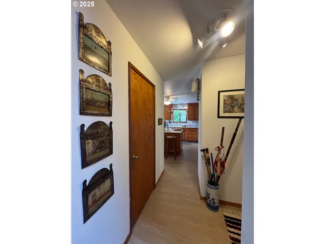 a view of a hallway with washer and dryer