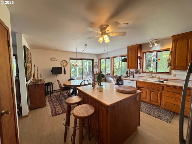 a large kitchen with a table and chairs