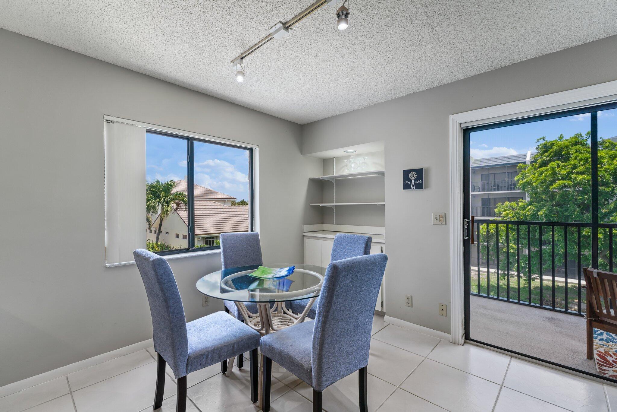 1605 Highway 1, Unit D301 Jupiter, FL 33477 - Photo 11 of 29 a view of a dining room with furniture window and outside view