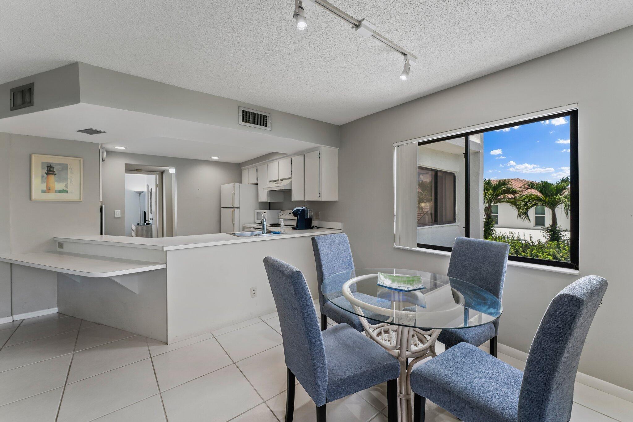 1605 Highway 1, Unit D301 Jupiter, FL 33477 - Photo 12 of 29 a view of a dining room with furniture and a livingroom
