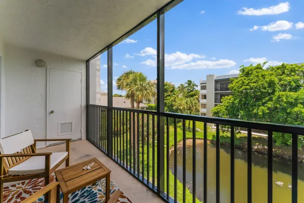 a view of a balcony with chairs