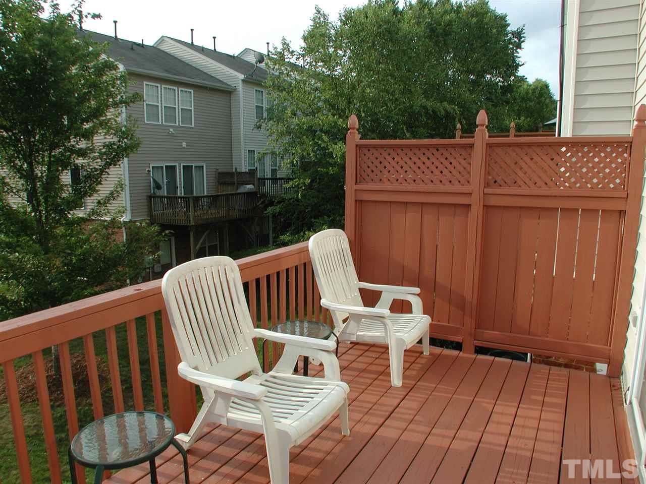 7040 Mead Lane Raleigh, NC 27613 - Photo 22 of 25 a view of a deck with wooden floor and fence