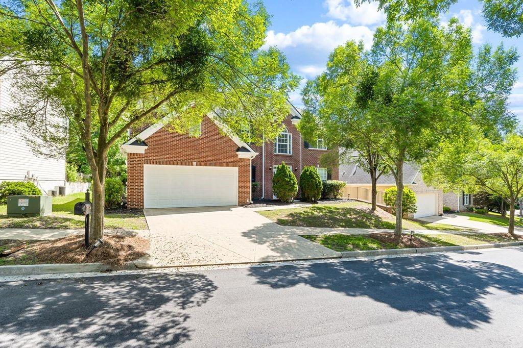 473 Greyhawk Way Fairburn, GA 30213 - Photo 33 of 34 a front view of a house with a yard and trees
