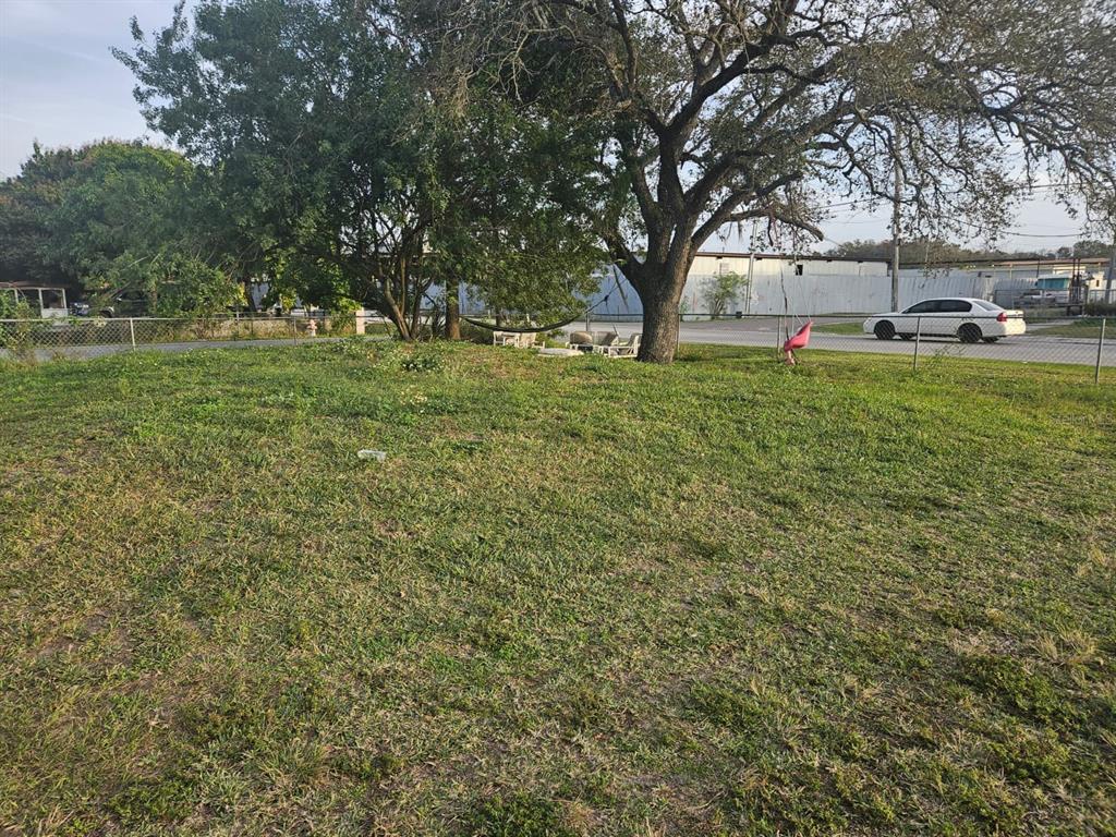 129 4th Street Orlando, FL 32824 - Photo 20 of 27 a view of yard with trees