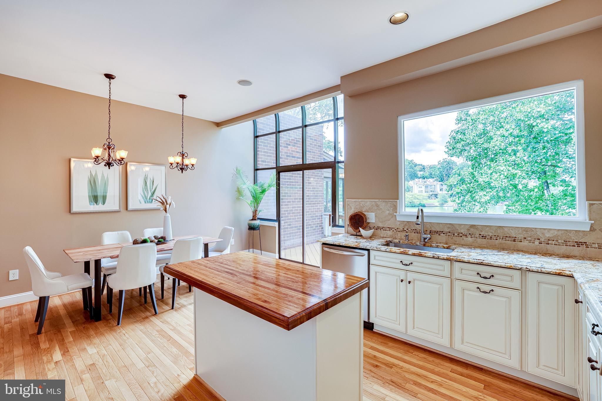 11056 Thrush Ridge Road Reston, VA 20191 - Photo 16 of 62 a view of a kitchen area with furniture wooden floor and dining table