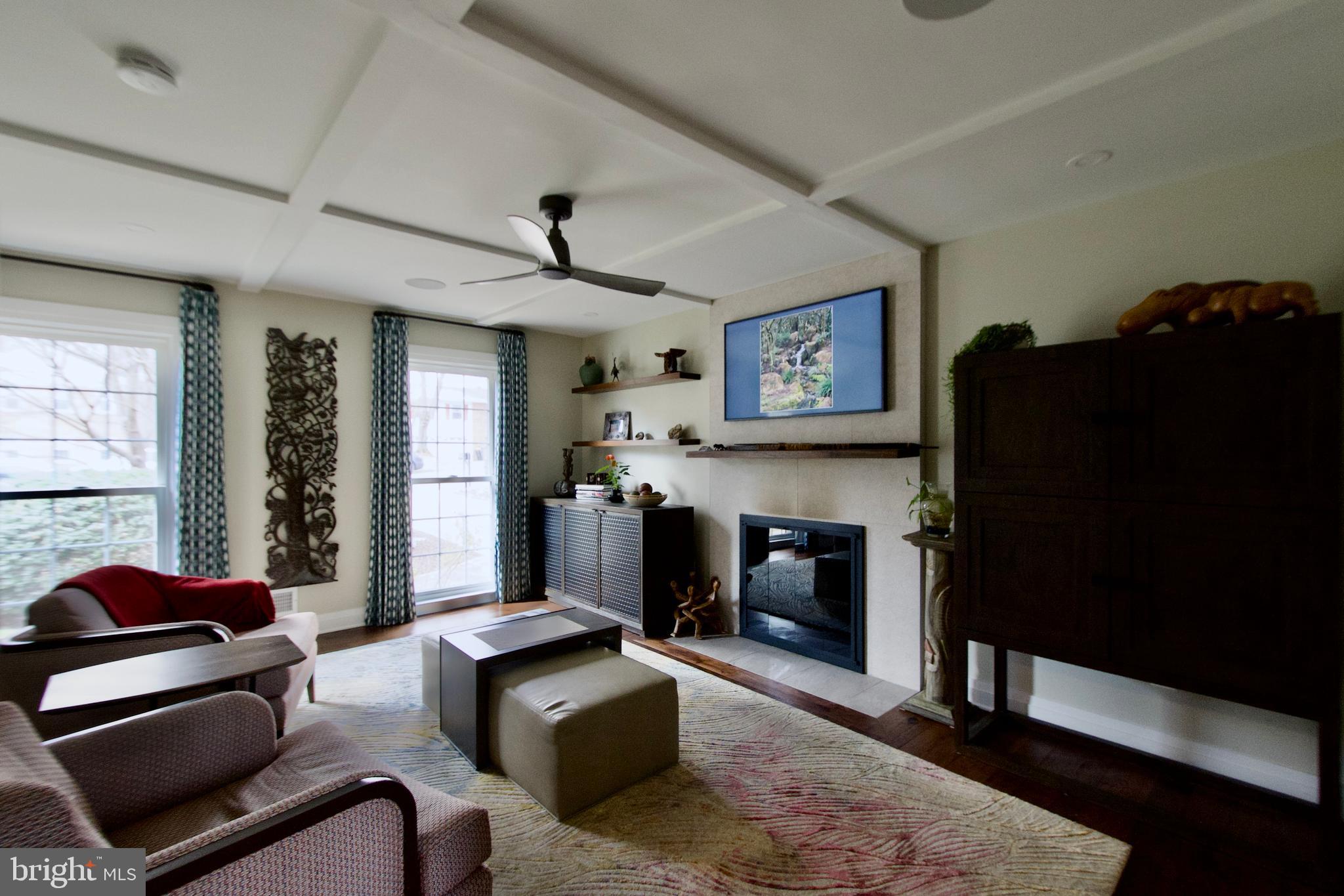 8816 Arley Drive Springfield, VA 22153 - Photo 13 of 59 a living room with furniture and a fireplace