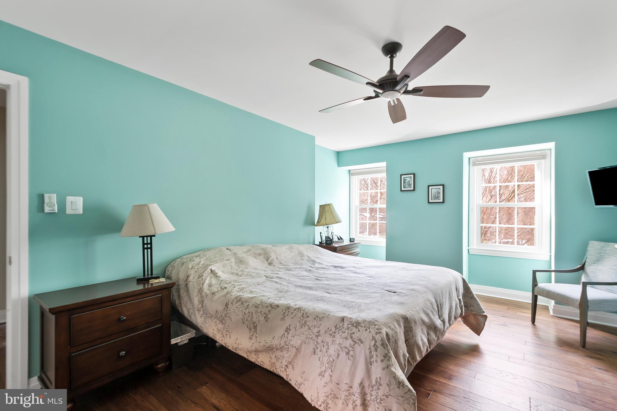 8816 Arley Drive Springfield, VA 22153 - Photo 27 of 59 a bedroom with a bed and a chandelier