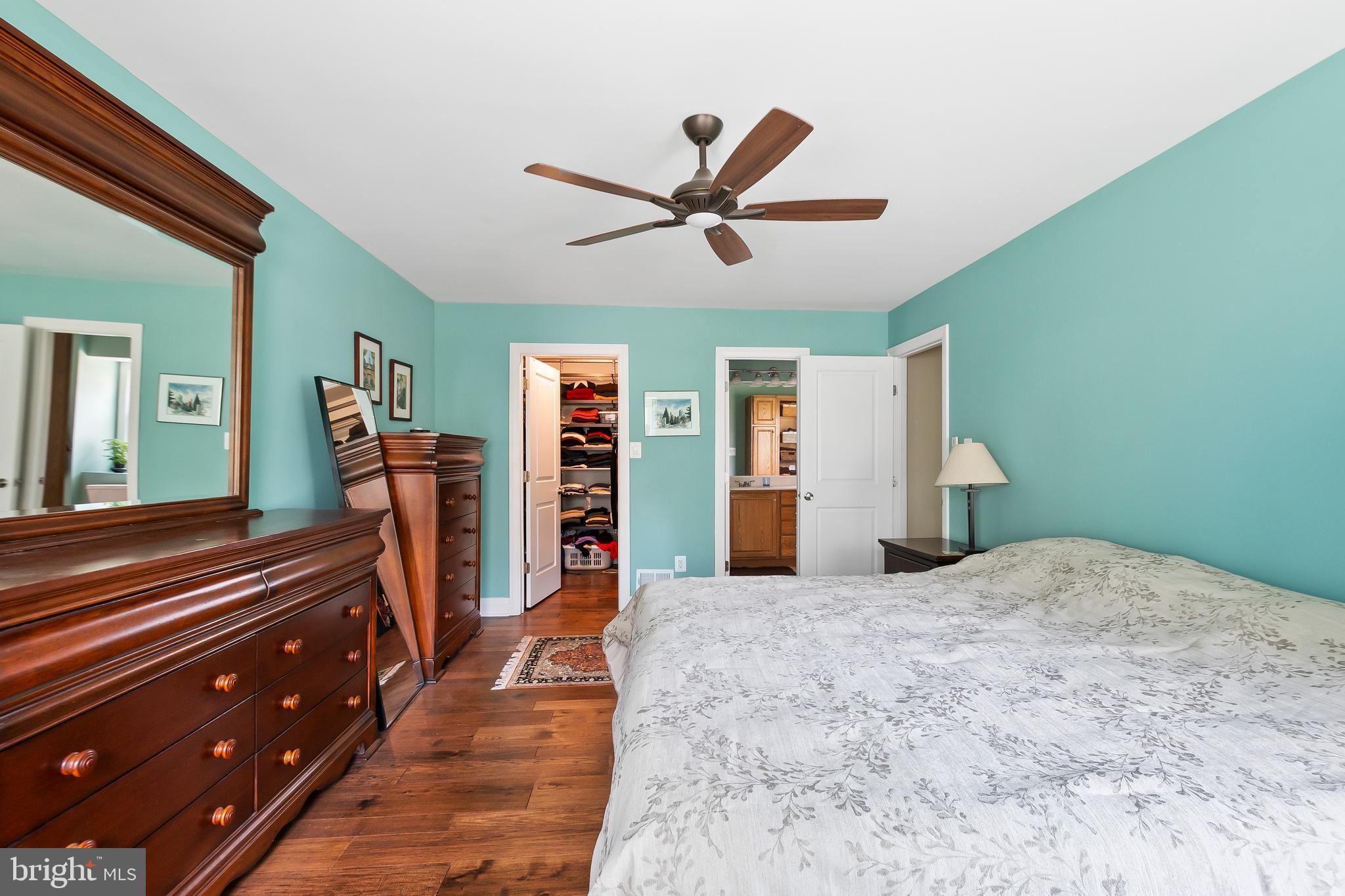 8816 Arley Drive Springfield, VA 22153 - Photo 29 of 59 a bed room with a bed and a chandelier