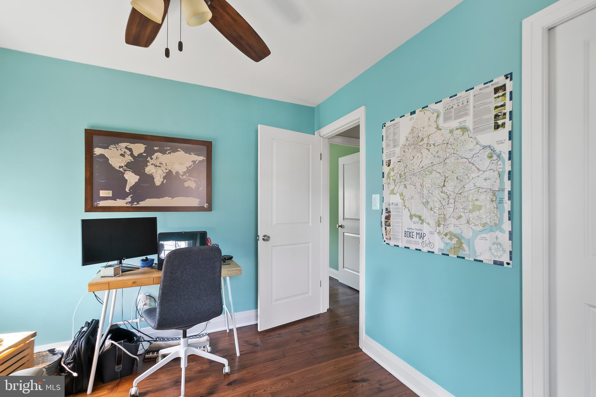 8816 Arley Drive Springfield, VA 22153 - Photo 39 of 59 a view of a workspace with furniture and a ceiling fan