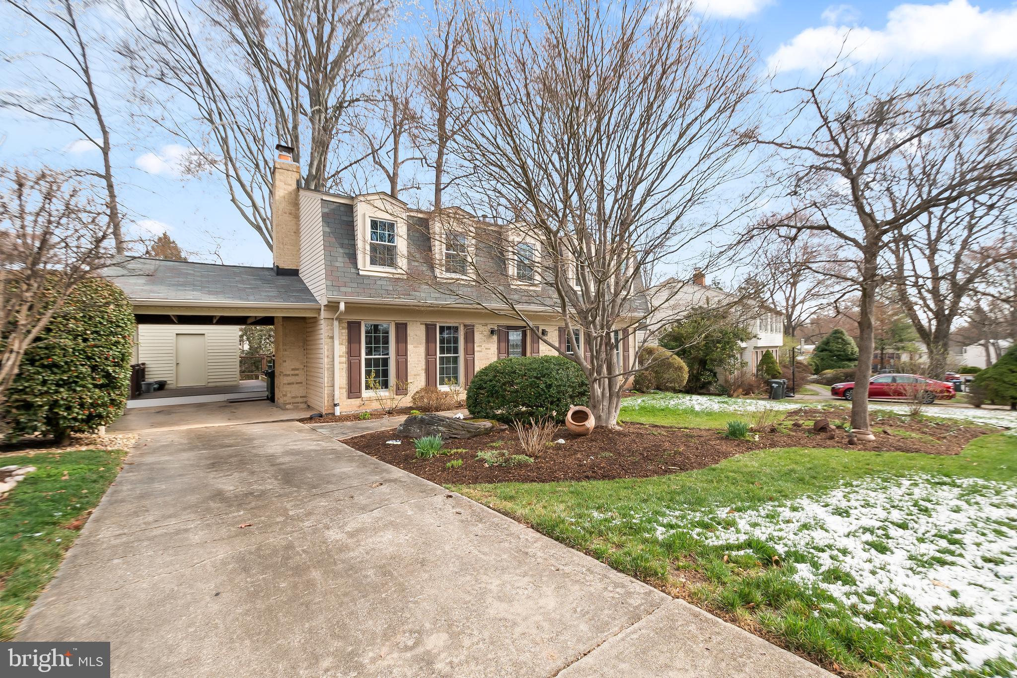 8816 Arley Drive Springfield, VA 22153 - Photo 4 of 59 a front view of a house with yard and green space
