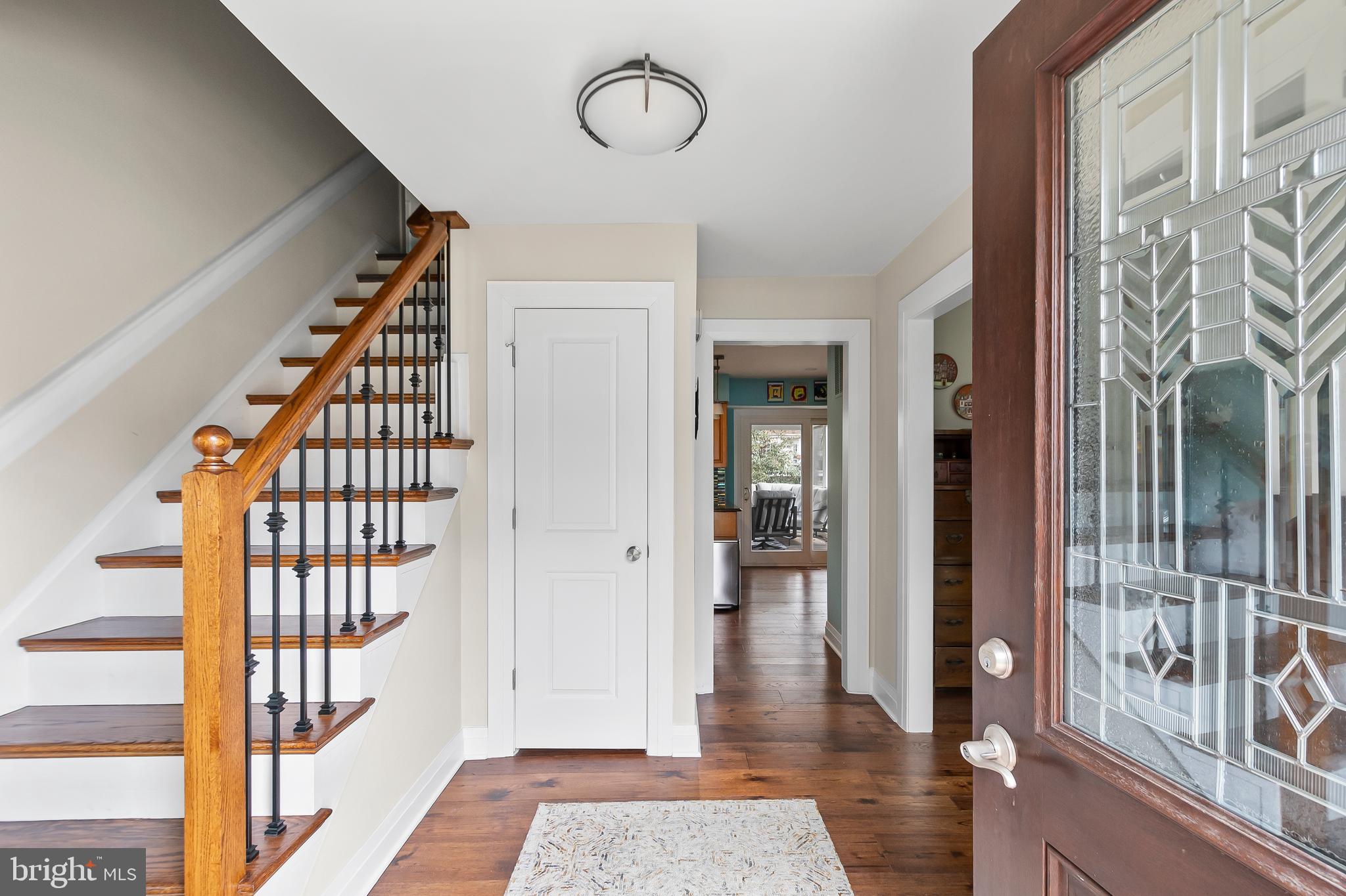 8816 Arley Drive Springfield, VA 22153 - Photo 5 of 59 a view of a hallway with wooden floor and staircase